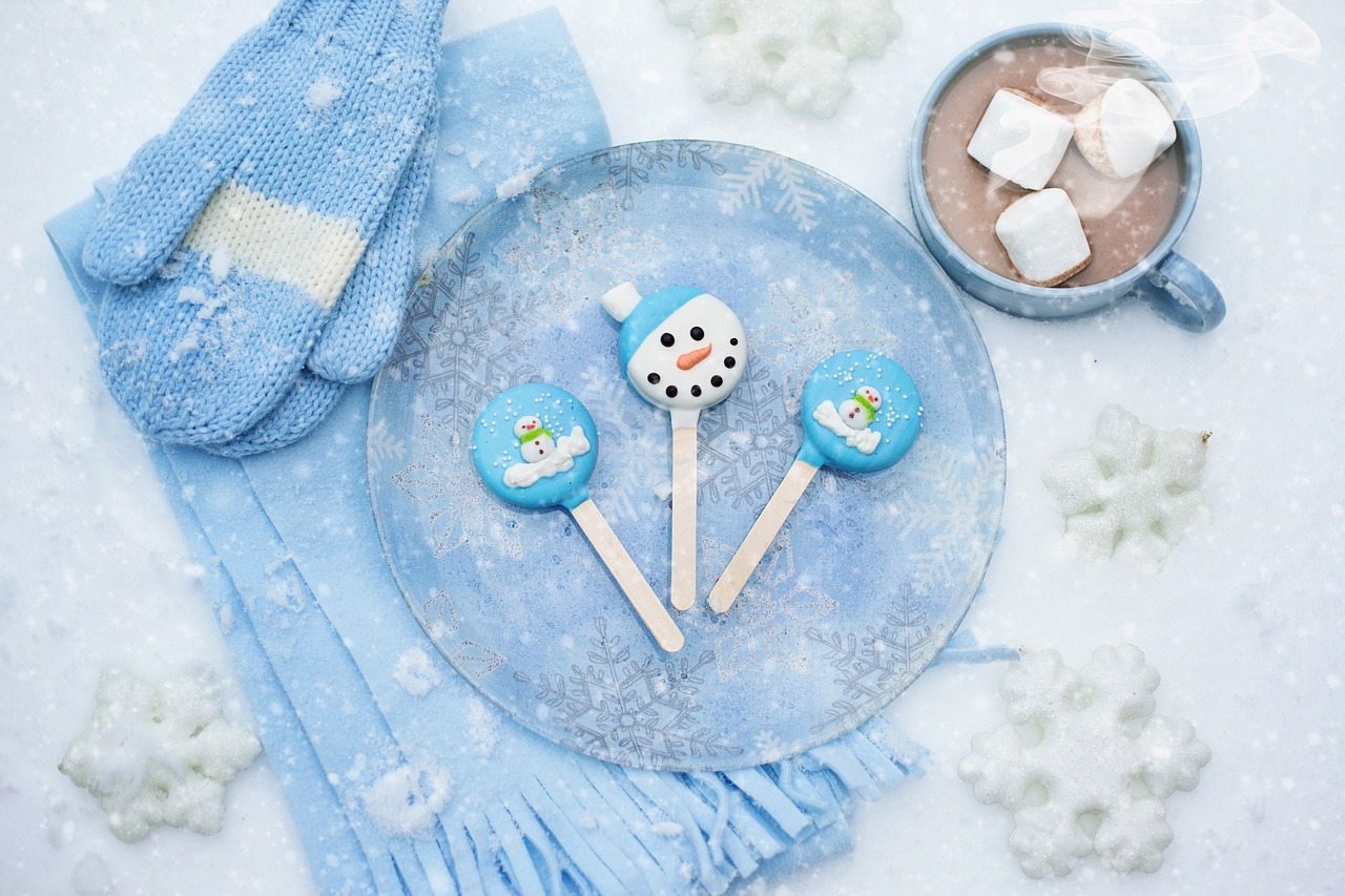 Winter-themed treats with hot chocolate and snowflake decor