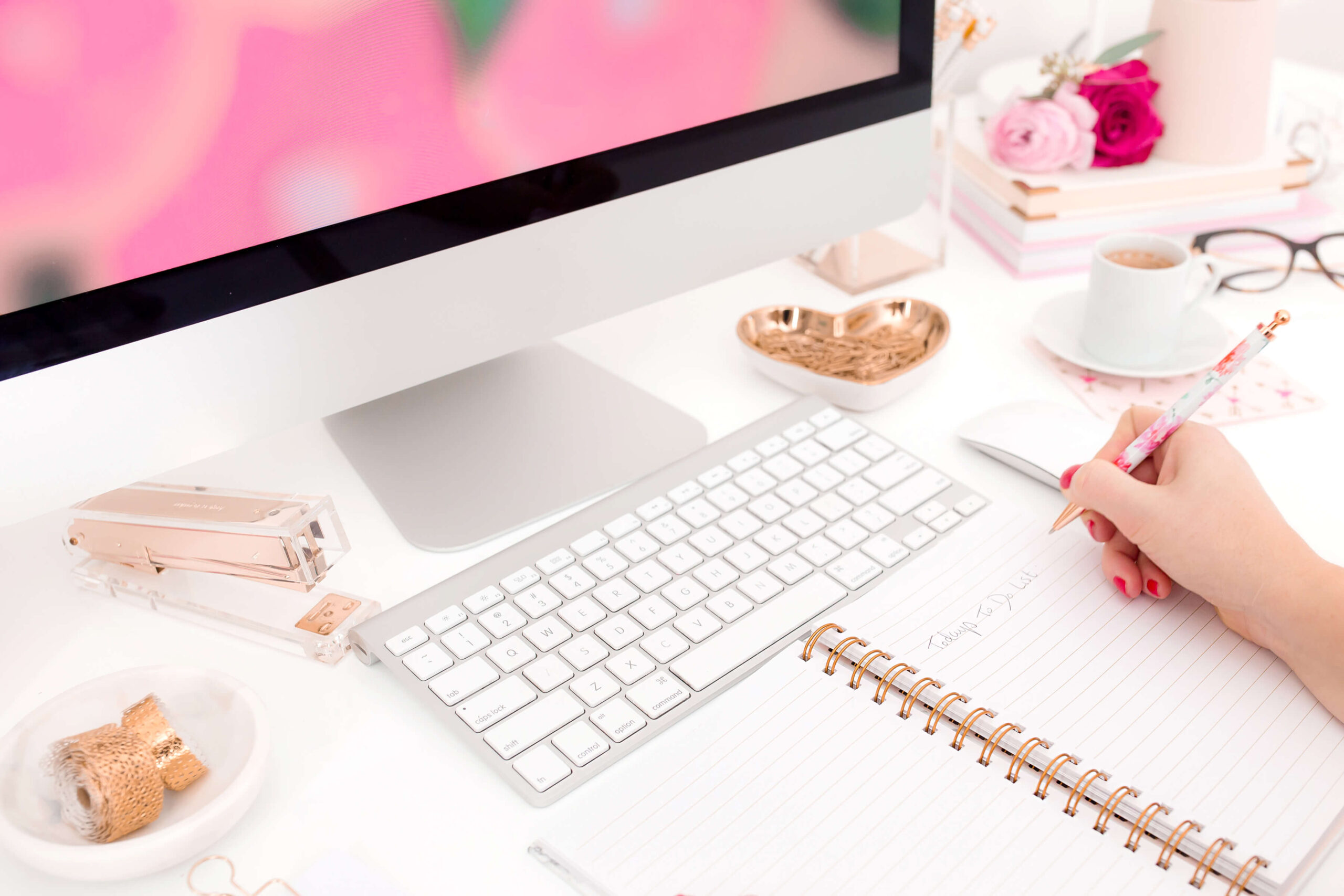 Stylish feminine workspace with computer and floral decor