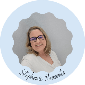 Smiling woman in white shirt and glasses