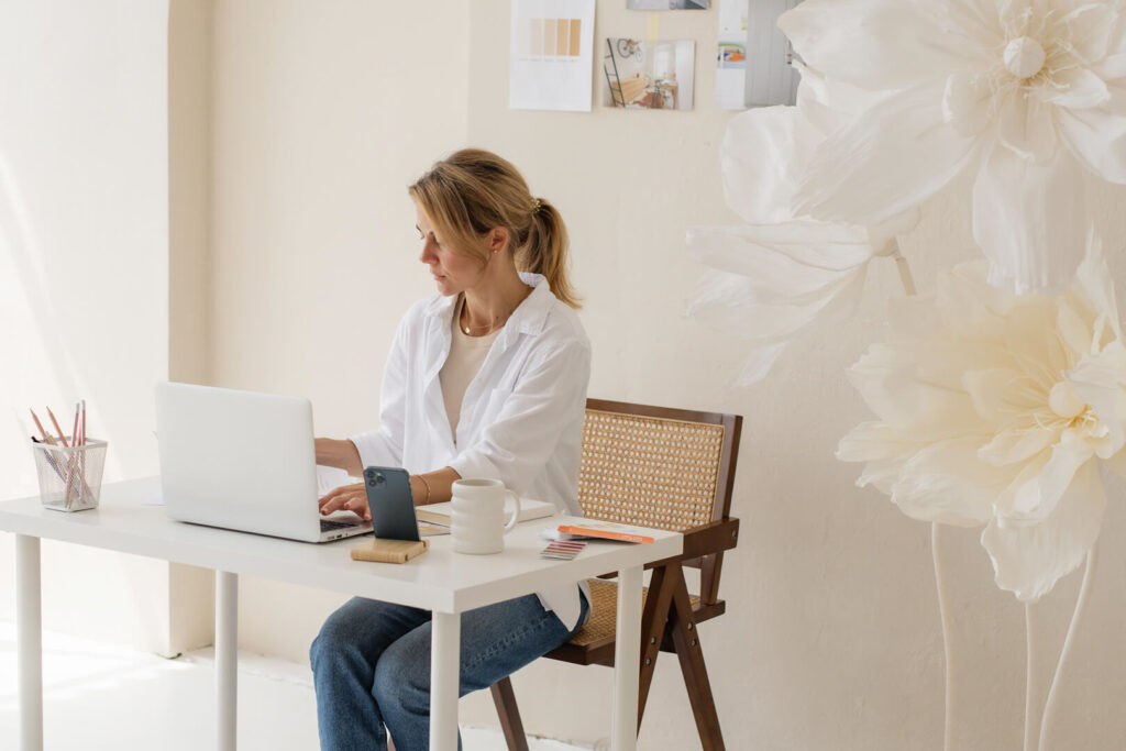 Woman working on laptop at home office