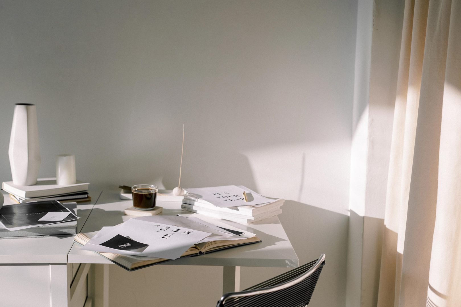 Minimalist desk with books and coffee