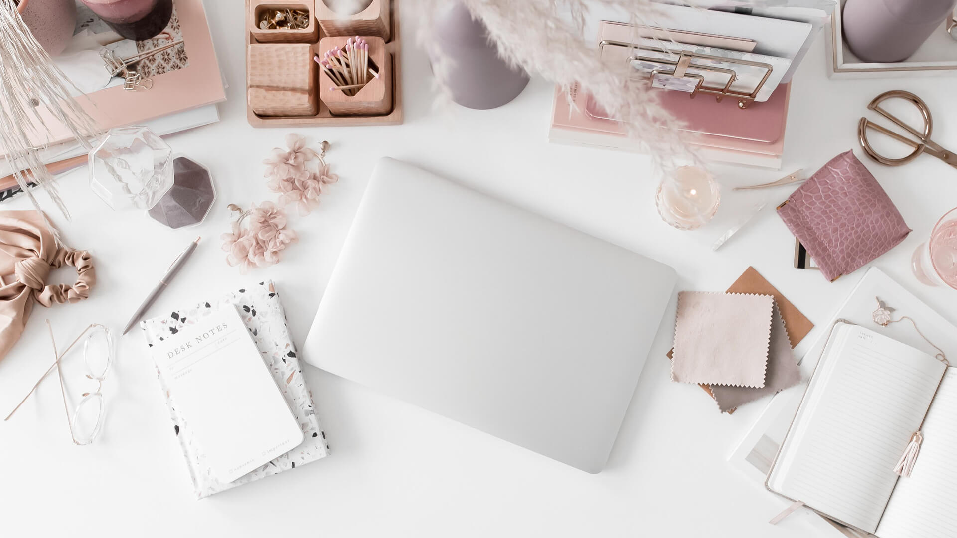Stylish workspace with laptop and office supplies.