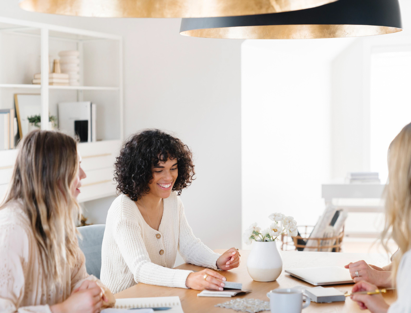 Smiling women having a meeting at office table.