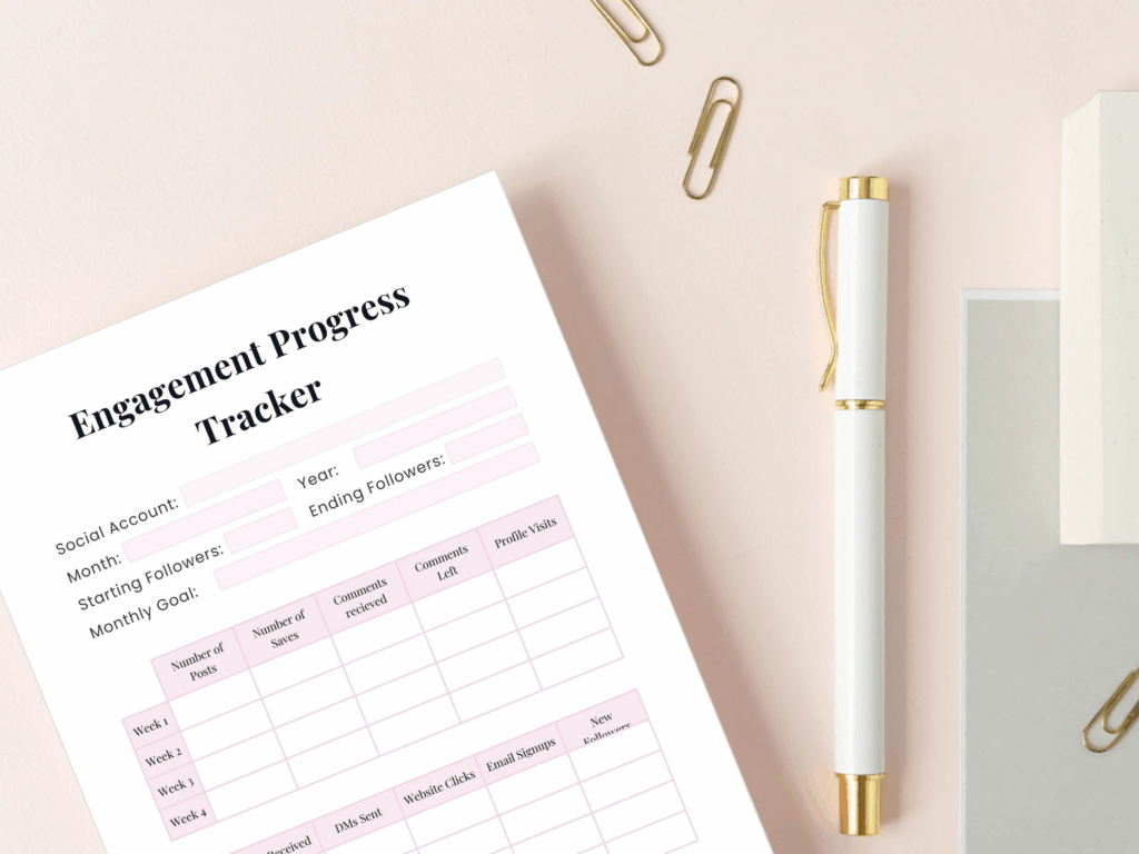 Engagement progress tracker on desk with pen and clips.