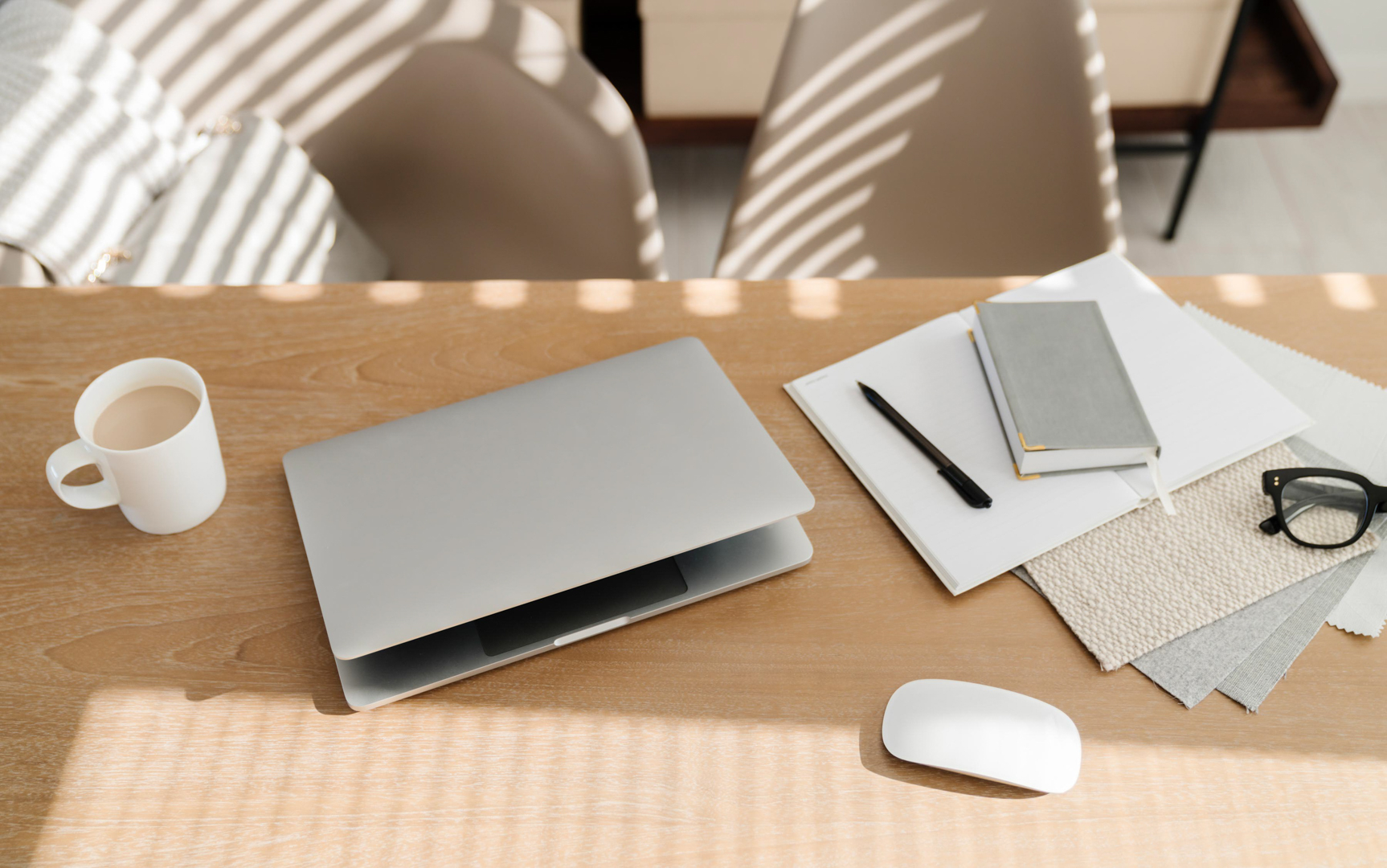 Laptop and coffee on wooden desk