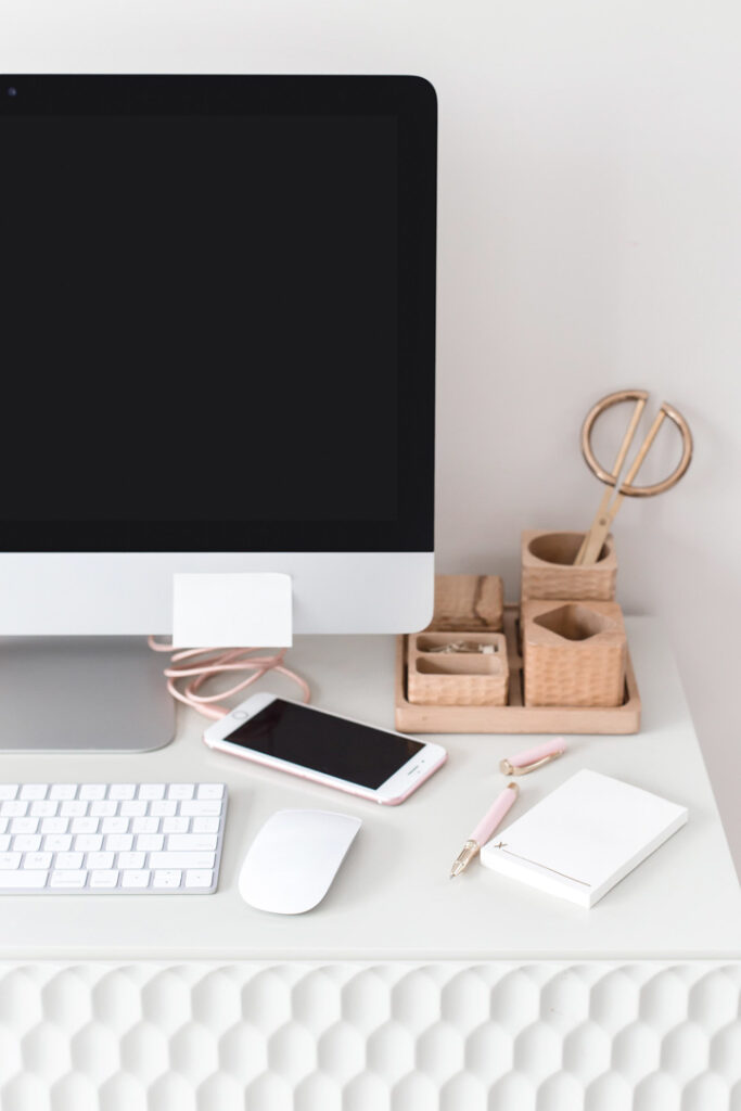 Minimalist workspace with computer and phone