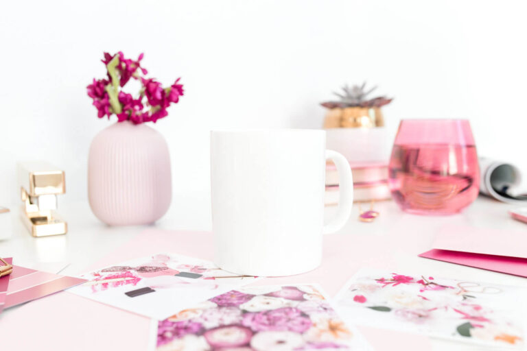 White mug on a pink-themed desk