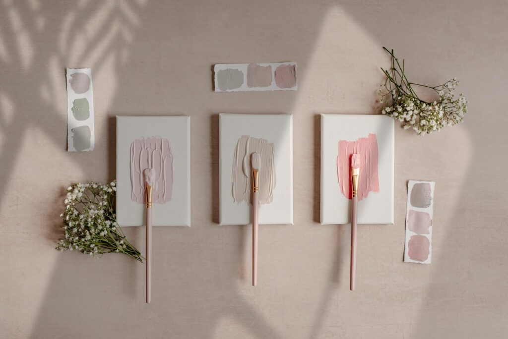 Pastel paint swatches and flowers on canvas